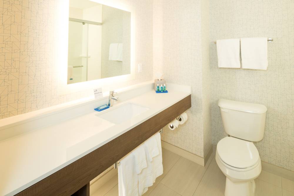 Guest bathroom featuring  complimentary amenities